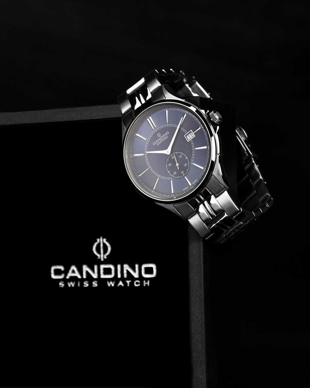 🕰️ The Enduring Legacy: A Deep Dive into Cartier Santos History & Evolution by Watch Brands a watch sitting on top of a black box